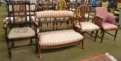 Lot 495 - An Edwardian upholstered settee, a mahogany open armchair - upholstered to match, a mahogany...