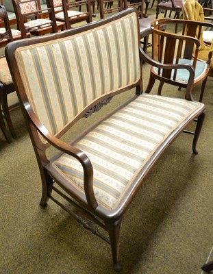 Lot 497 - Edwardian stained beech settee