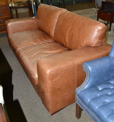 Lot 504 - Tan leather type two seater sofa