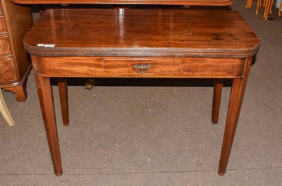 Lot 1284 - A George III mahogany fold-over tea table with...