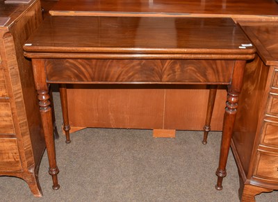 Lot 1289 - A 19th century mahogany foldover tea table on...