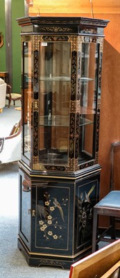 Lot 1400 - A reproduction black and gilt lacquered glazed...