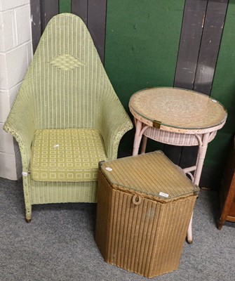 Lot 1416 - ~  A Lloyd Loom gold linen box, a basket chair,...