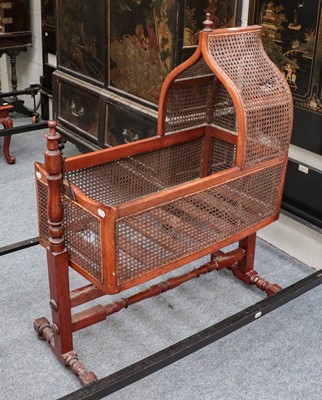 Lot 1433 - ~  A Victorian mahogany and cane sided crib on...