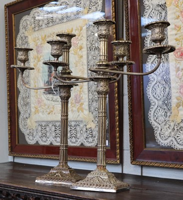 Lot 129 - A pair of silver-plated two branch sconce...