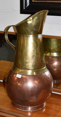 Lot 1462 - A large brass and copper jug, 69cm high