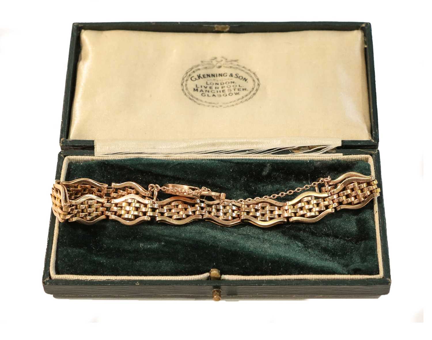 Lot 248 - A fancy link bracelet, stamped '9CT', with a...