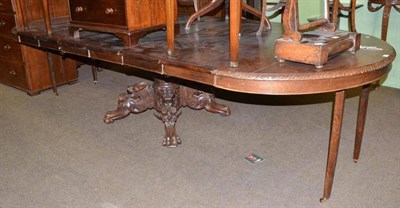 Lot 535 - Victorian extending dining table with central carved support decorated with dragon heads