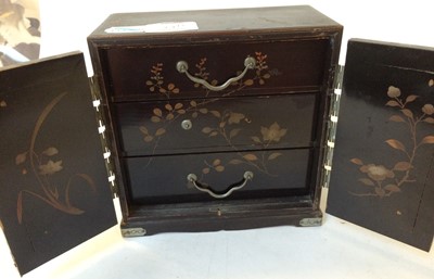 Lot 27 - A Japanese lacquer and gilt miniature chest of...