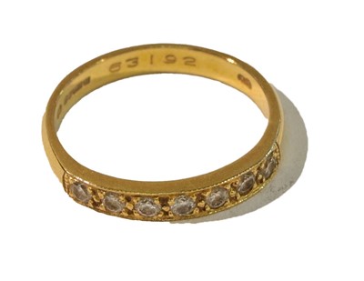 Lot 255 - An 18 carat gold diamond seven stone ring,...