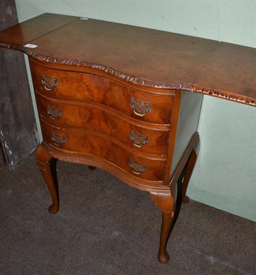 Lot 541 - A Queen Anne style burr walnut side cabinet with two flaps and serpentine front