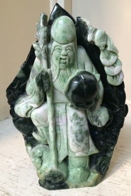 Lot 58 - A group of Oriental green hardstone carvings,...
