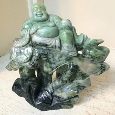 Lot 58 - A group of Oriental green hardstone carvings,...