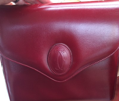 Lot 2247 - Le Must de Cartier Burgundy Leather Shoulder...