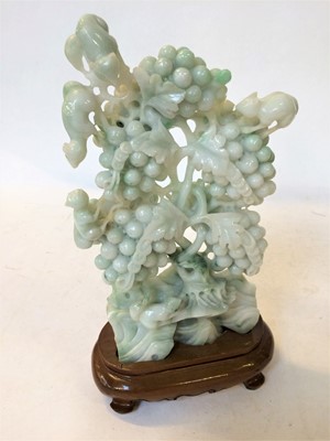 Lot 49 - 20th century Chinese green hardstone carvings,...