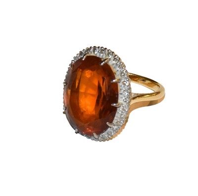 Lot 262 - A citrine and diamond cluster ring, stamped...