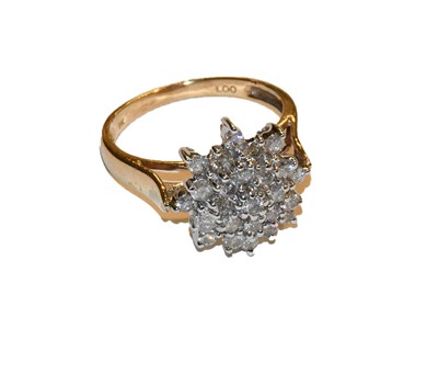 Lot 270 - A 9 carat gold diamond cluster ring, finger...