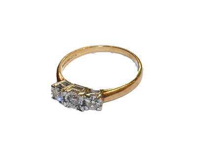 Lot 275 - A 9 carat gold diamond three stone ring,...
