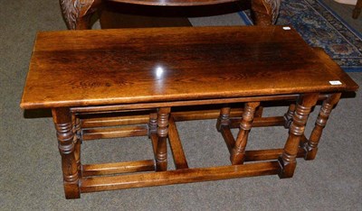 Lot 566 - Oak nest of tables, with turned legs joined by stretchers