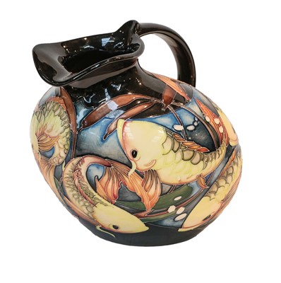 Lot 178 - Modern Moorcroft pottery: a jug decorated in...