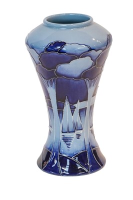 Lot 181 - Modern Moorcroft pottery: a blue ground vase...
