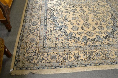 Lot 575 - A Nain carpet, Central Persia, the ivory field of scrolling vines centred by a medallion, framed by