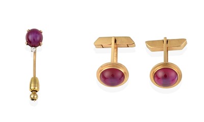 Lot 2410 - A Pair of Synthetic Star Ruby Cufflinks and A Synthetic Star Ruby and Diamond Stickpin