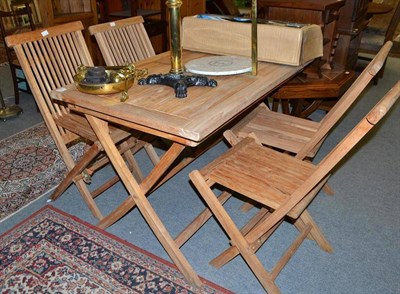 Lot 596 - Teak garden table and four folding chairs and a sand pit