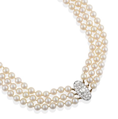 Lot 2072 - A Triple Row Cultured Pearl Necklace, with a Diamond Cluster Clasp