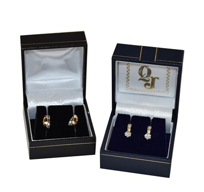 Lot 195 - A pair of diamond earrings, stamped '375'; and...