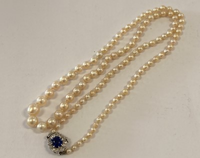 Lot 2000 - A Pearl Necklace, with a Sapphire and Diamond Cluster Clasp