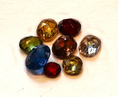Lot 233 - A collection of eight loose stones including...