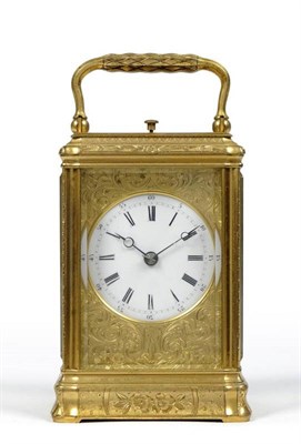 Lot 1023 - A French Gilt Brass Striking Carriage Clock, circa 1890, engraved floral decoration, carrying...