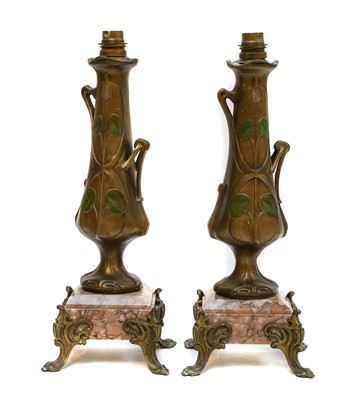 Lot 19 - A pair of secessionist gilt metal lamp bases...