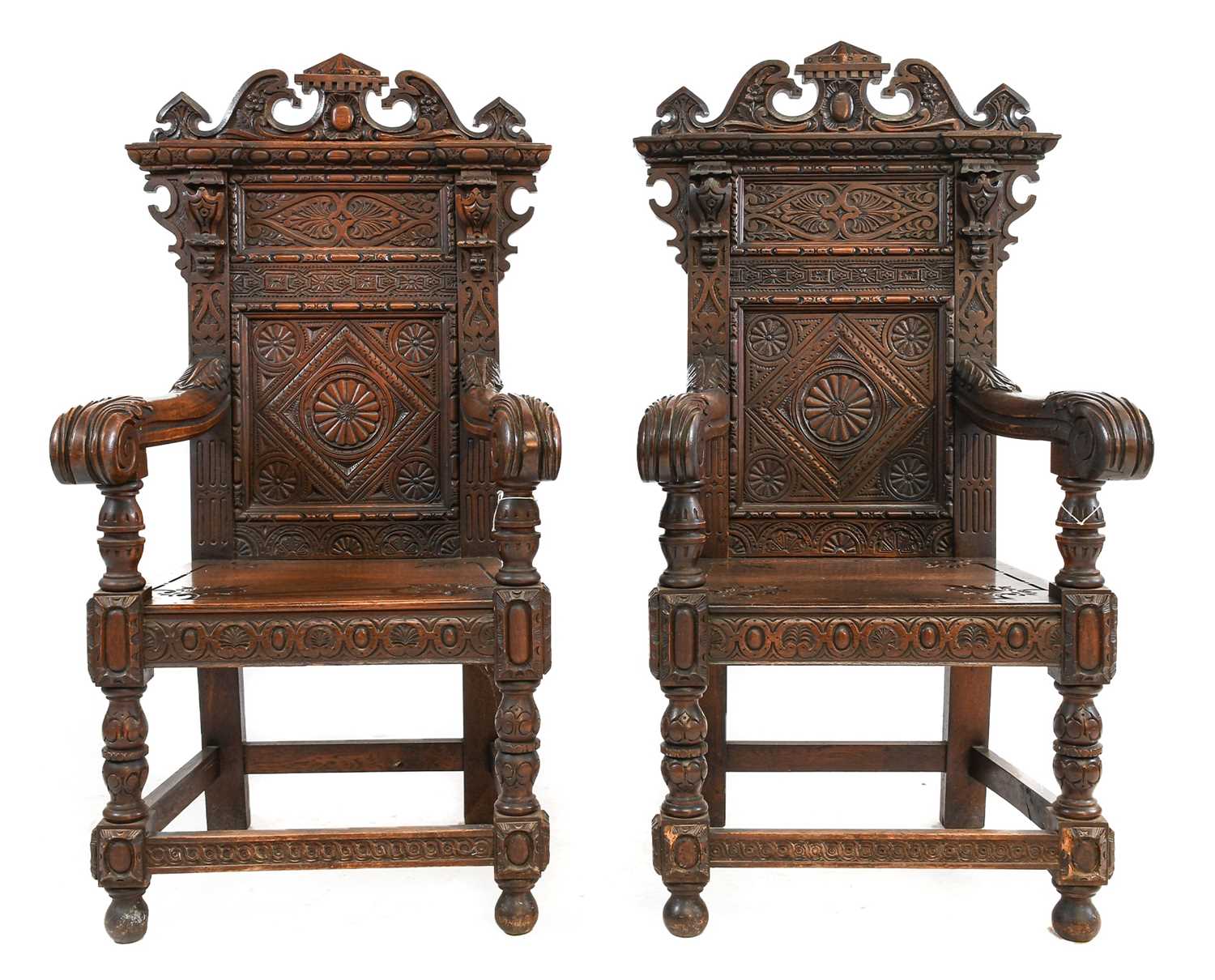 Lot 241 - ~ A Pair of Victorian Carved Oak Armchairs, in...