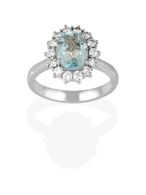 Lot 2432 - An 18 Carat White Gold Aquamarine and Diamond Cluster Ring