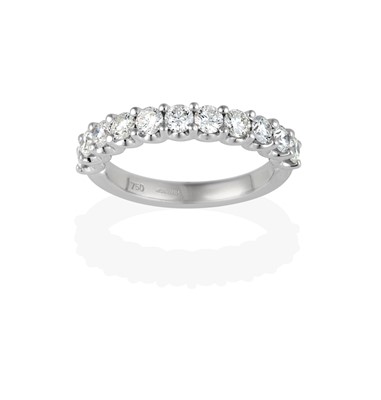 Lot 2402 - An 18 Carat White Gold Diamond Half Hoop Ring