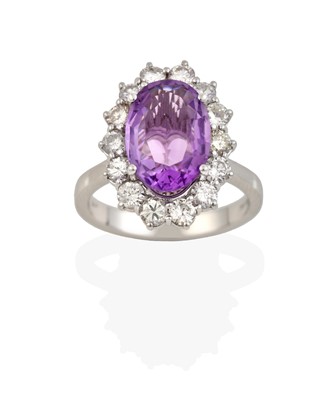 Lot 2419 - An 18 Carat White Gold Amethyst and Diamond Cluster Ring