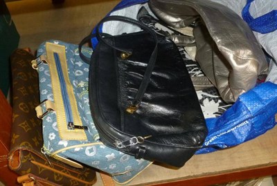 Lot 648 - Two shopping bags of handbags