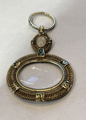 Lot 177 - A mourning hair work and enamel lorgnette,...