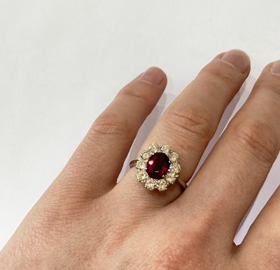 Lot 2050 - A Ruby and Diamond Cluster Ring