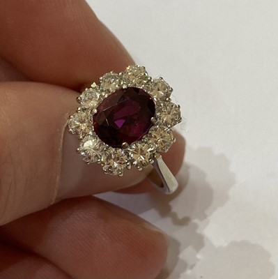 Lot 2050 - A Ruby and Diamond Cluster Ring