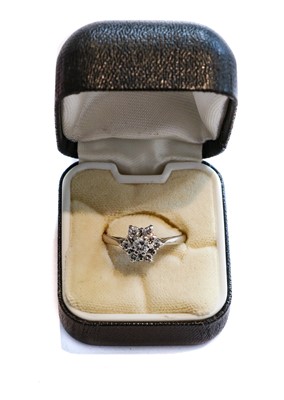 Lot 176 - An 18 carat white gold diamond cluster ring,...