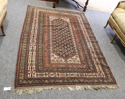 Lot 1104 - A Kurdish rug, the deep indigo stepped lozenge...