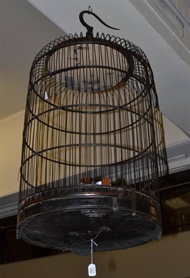 Lot 660 - A Chinese bamboo bird cage with two blue and white porcelain bird feeders