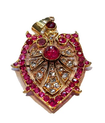 Lot 228 - A synthetic ruby and diamond pendant, length 4....