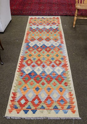 Lot 1095 - Afghan kilim runner, the polychrome stepped...