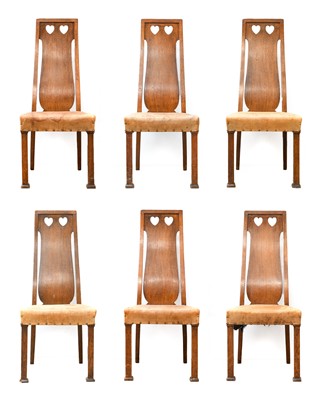Lot 224 - A Set of Six Arts & Crafts Oak Dining Chairs,...