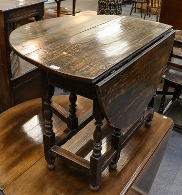 Lot 1074 - An 18th century oak gateleg table, 113cm by...