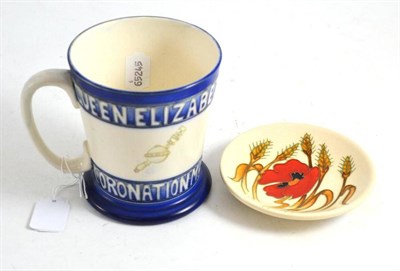 Lot 19 - A Moorcroft 1937 Coronation mug and a small saucer dish